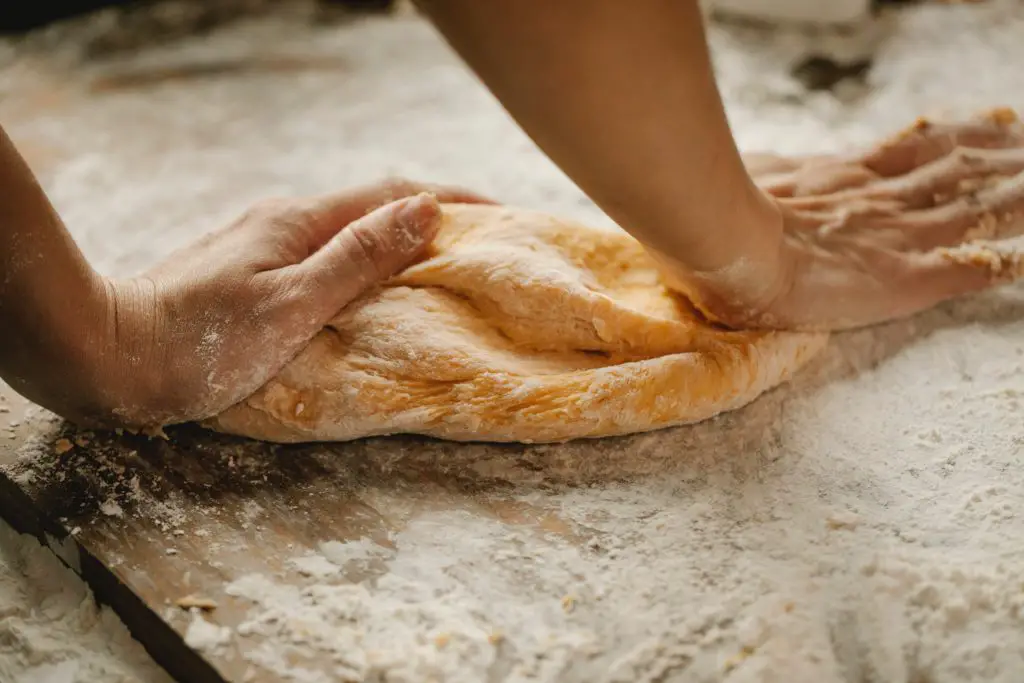 kneading the bread dough for the fresh baked bread recipe