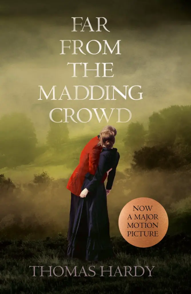 The book cover for Far From The Maddening Crowd showing a woman wearing 18th century clothes standing in a farmers field.