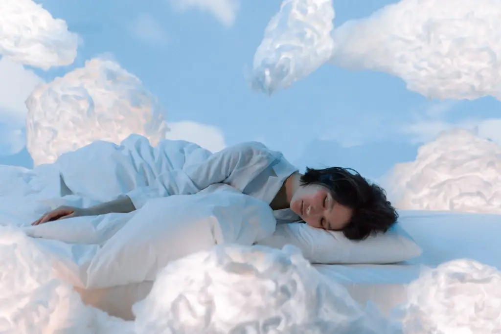 This woman is sleeping soundly on a bed of clouds, boosting her brain power with aromatherapy. 