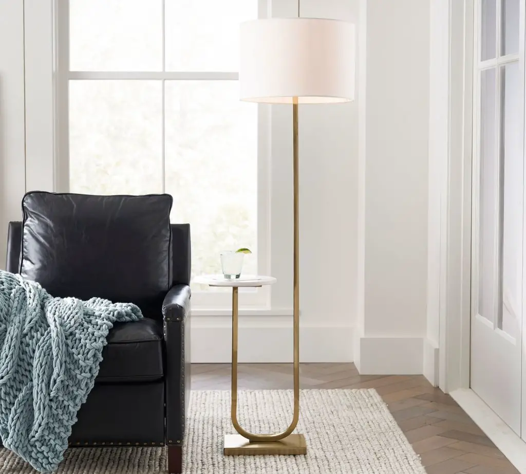 a lamp providing warm ambient lighting in a cozy reading space