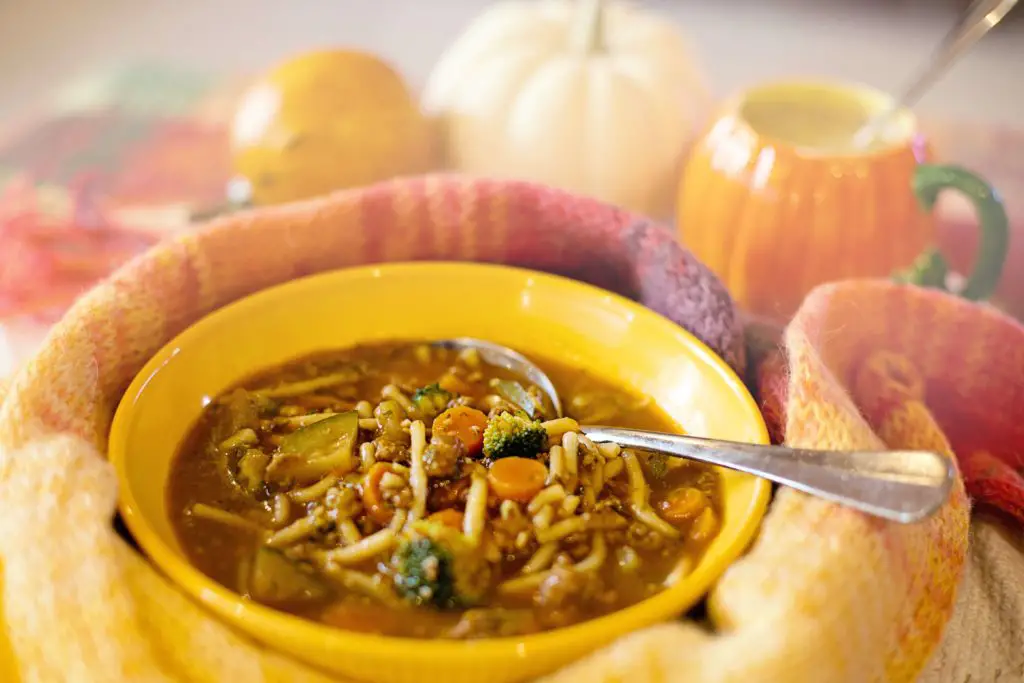 This image shows a deliciously hearty and cottagecore inspired bowl of soup